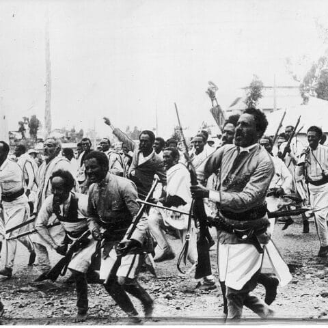 The powerful image—public domain from Wikimedia Commons—shows Ethiopian troops en route to the northern front, just weeks after Italy’s invasion began in October 1935.