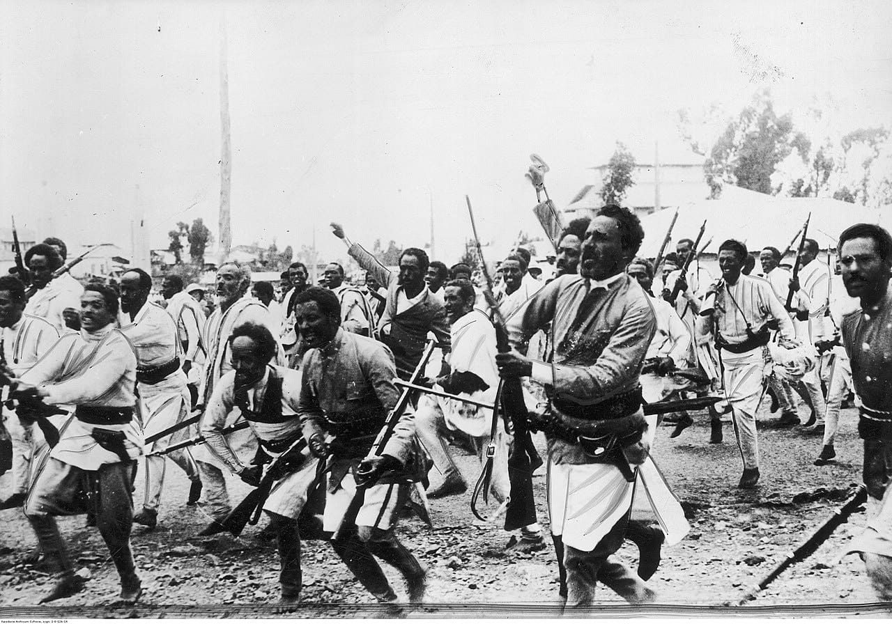 powerful image—public domain from Wikimedia Commons—shows Ethiopian troops en route to the northern front, just weeks after Italy’s invasion began in October 1935.
